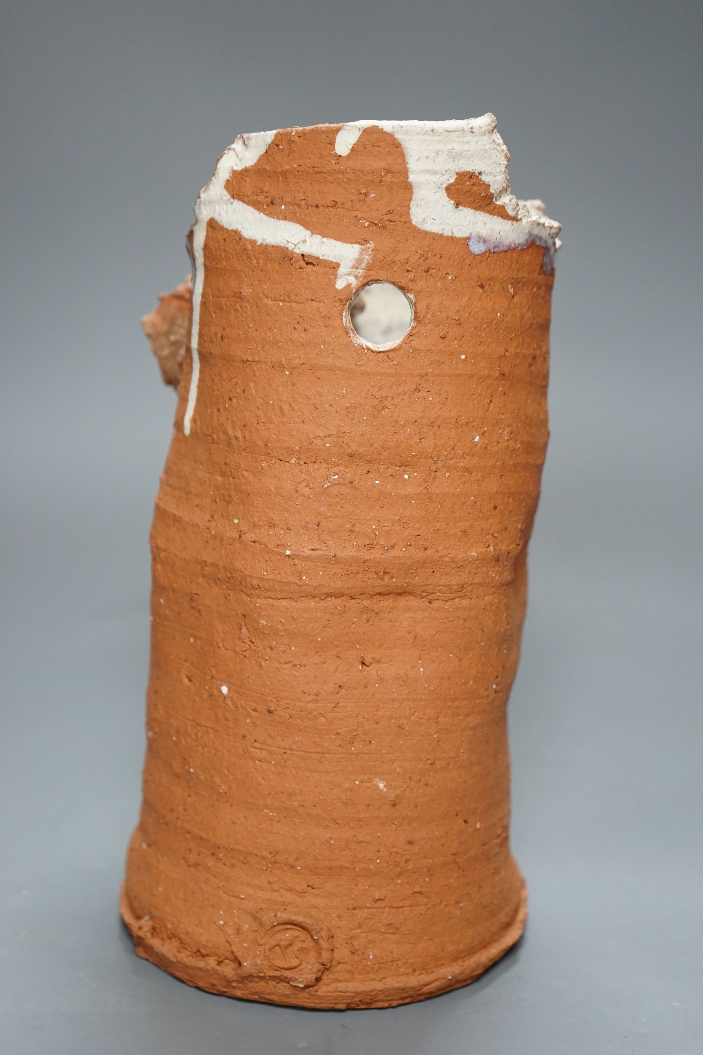 Peter Smith, a thrown terracotta cylindrical vessel with white glaze to the interior and brown nose vessel, with original purchase receipt, impressed mark to base rim, 26.5cm tall
